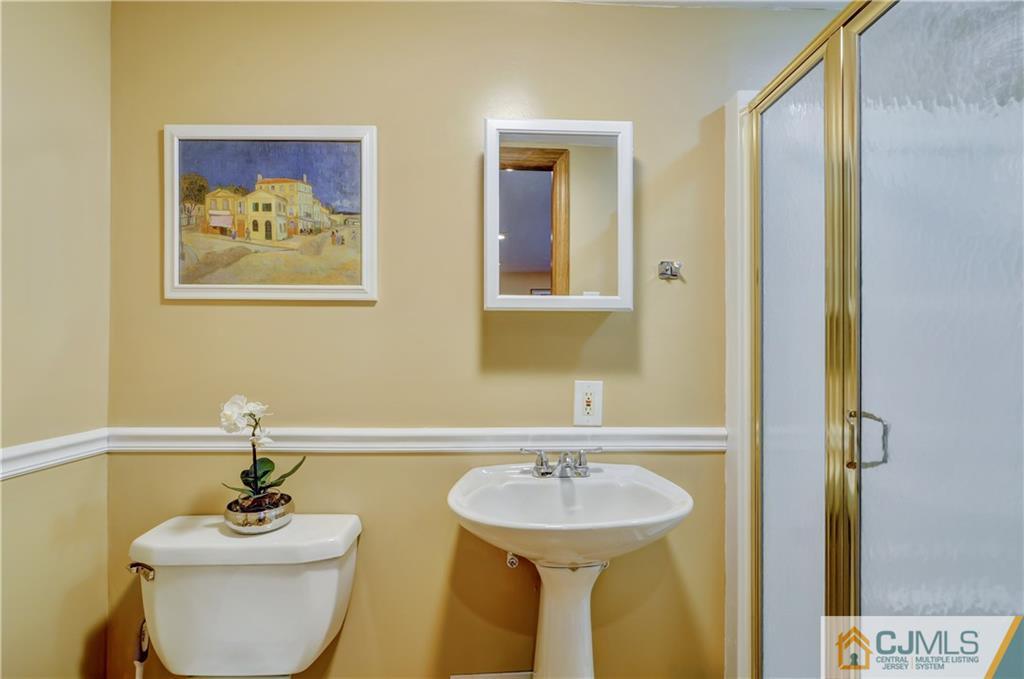 40 Meyer Road Edison, NJ 08817 - Photo 8 of 24 a bathroom with a sink and a mirror