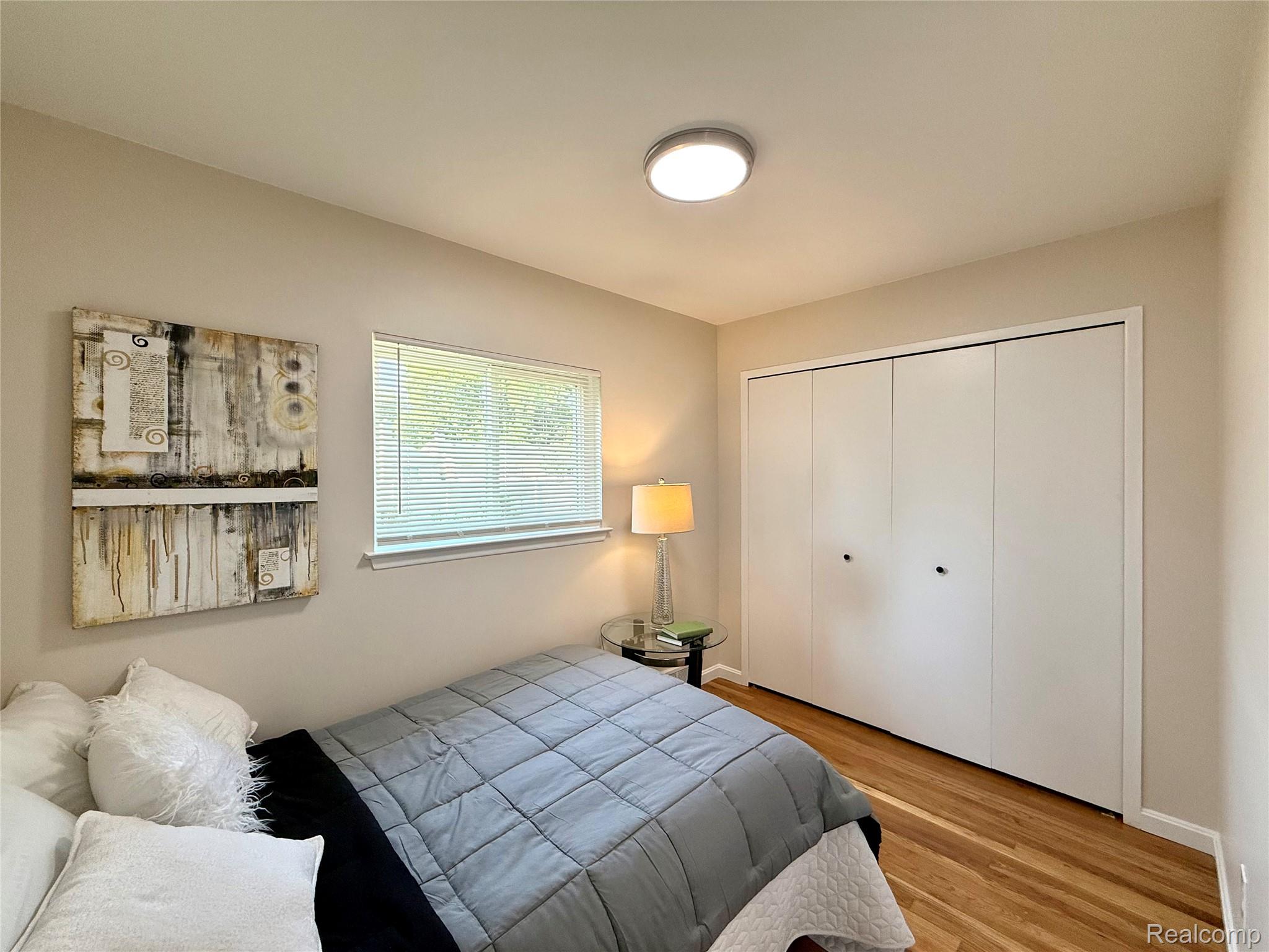 39909 Lynn Street Canton, MI 48187 - Photo 21 of 45 Bedroom featuring wood-finish flooring, a window with blinds, and a ceiling-mounted light fixture