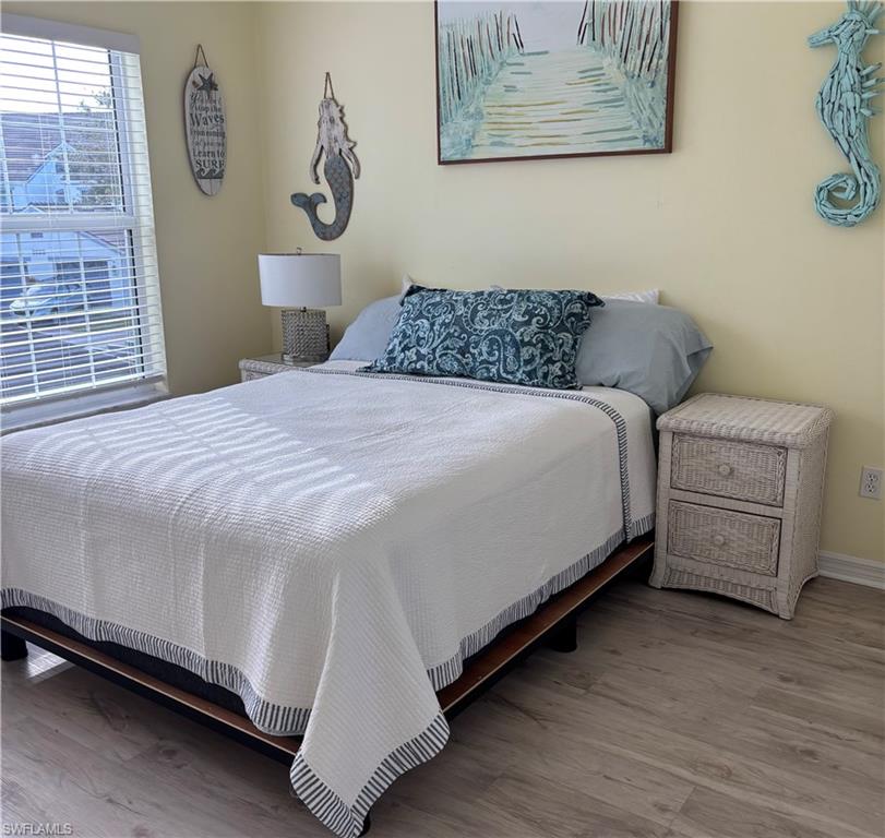 5928 Sand Wedge Lane, Unit 1808 Naples, FL 34110 - Photo 12 of 29 a bedroom with a bed and a window