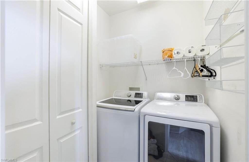 5928 Sand Wedge Lane, Unit 1808 Naples, FL 34110 - Photo 15 of 25 a utility room with dryer and washer