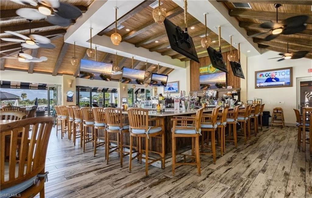 5928 Sand Wedge Lane, Unit 1808 Naples, FL 34110 - Photo 22 of 25 a view of a bar restaurant