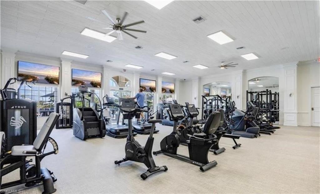 5928 Sand Wedge Lane, Unit 1808 Naples, FL 34110 - Photo 22 of 29 a view of a room with gym equipment