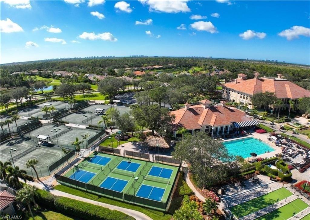5928 Sand Wedge Lane, Unit 1808 Naples, FL 34110 - Photo 29 of 29 an aerial view of residential houses with outdoor space and parking