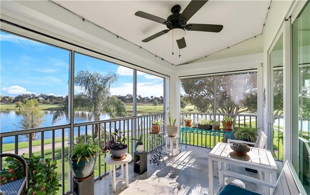 5928 Sand Wedge Lane, Unit 1808 Naples, FL 34110 - Photo 8 of 25 a living room filled with furniture and a potted plant