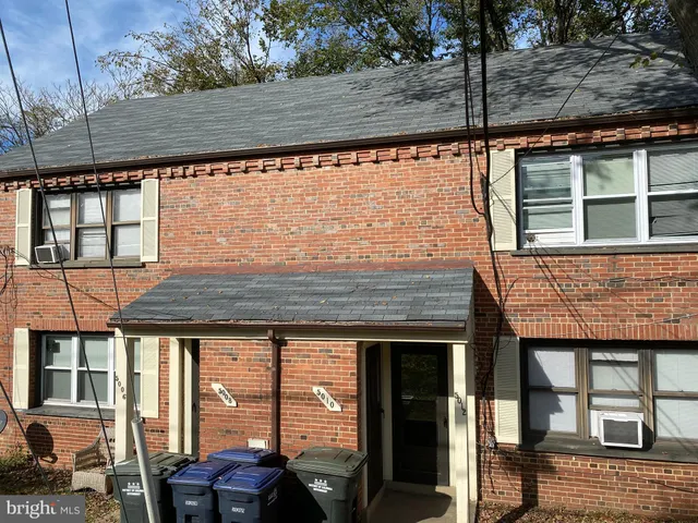 a front view of a house with parking area