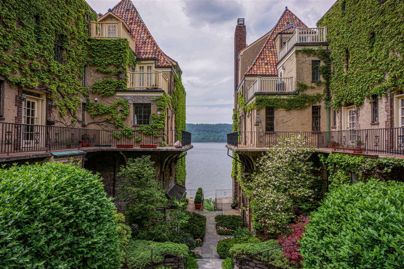 2501 Palisade Avenue, Unit G1 Bronx, NY 10463 - Photo 4 of 24 front view of house with a yard and potted plants