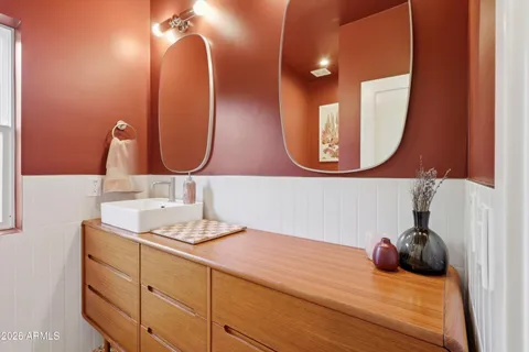 a white toilet sitting next to a shower curtain
