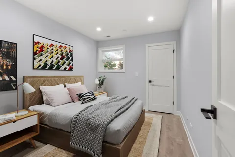 a bedroom with bed and a window