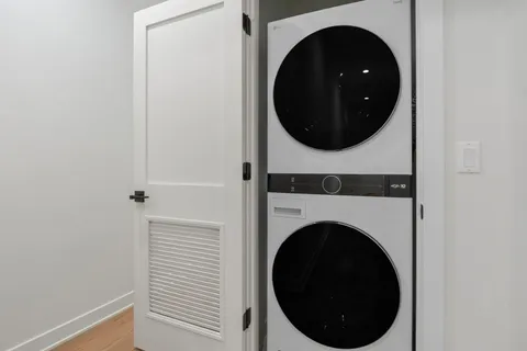 a view of a hallway with washer and dryer