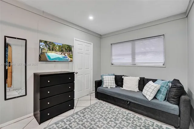 a bedroom with a bed and walk in closet