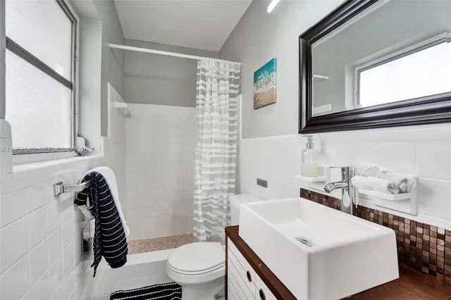 a bed room with furniture and a window