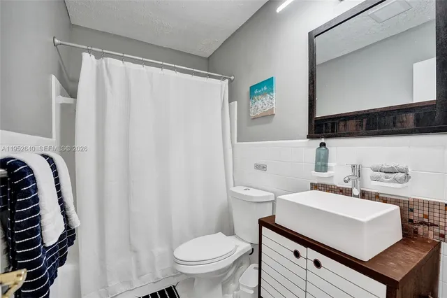 a bedroom with two beds and a large window