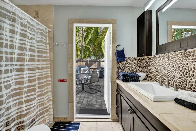 a kitchen with stainless steel appliances a refrigerator sink and cabinets