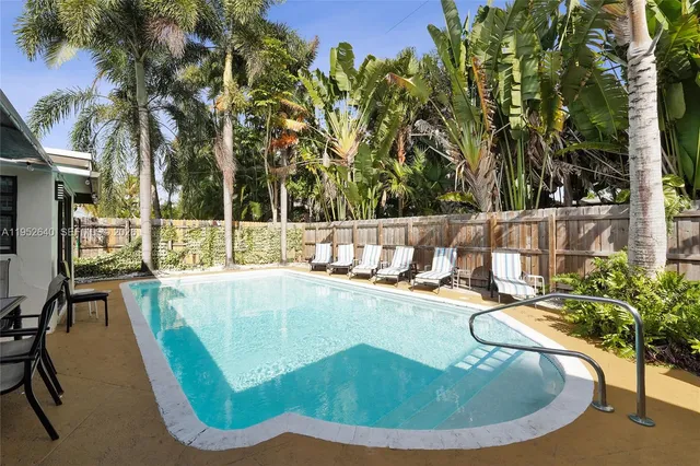 a view of a swimming pool with a patio