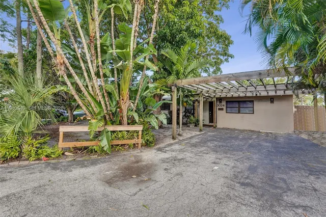 front view of a house with a garden