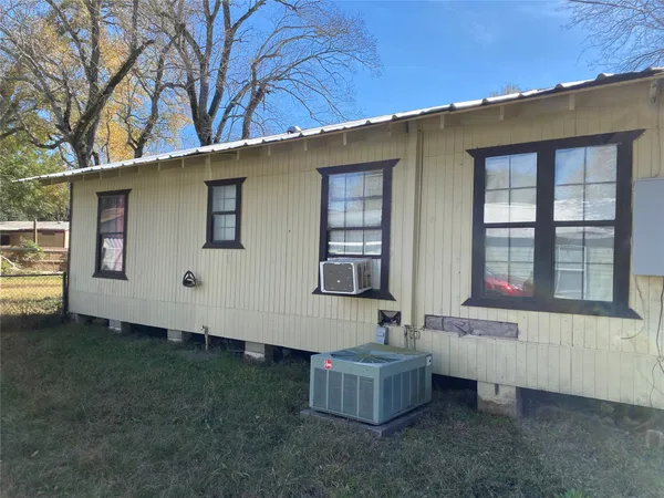 a kitchen with green cabinets a sink and a stove top oven