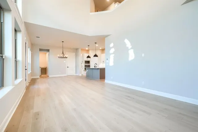 a view of a kitchen with a sink and cabinets