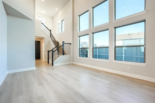 a view of an entryway with wooden floor