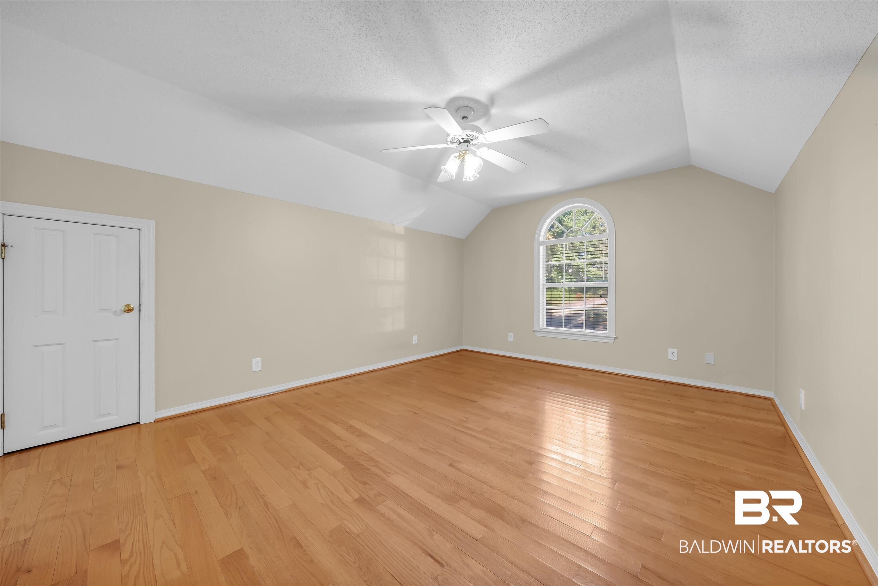 1262 Patrick Street Daphne, AL 36526 - Photo 24 of 35 Additional living space with vaulted ceiling, light wood-style floors, and ceiling fan