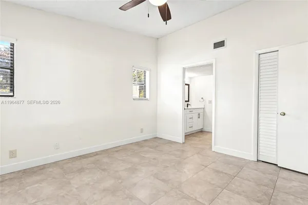 an empty room with a bathroom
