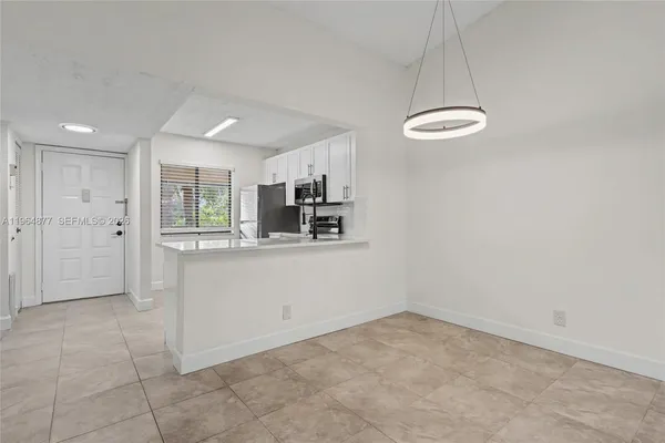 a view of a kitchen with a sink