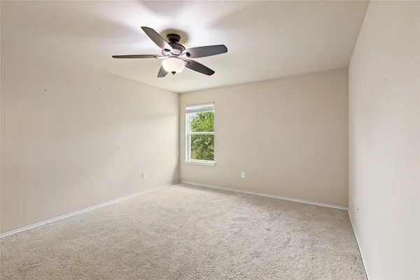 a bathroom with a granite countertop sink mirror and shower