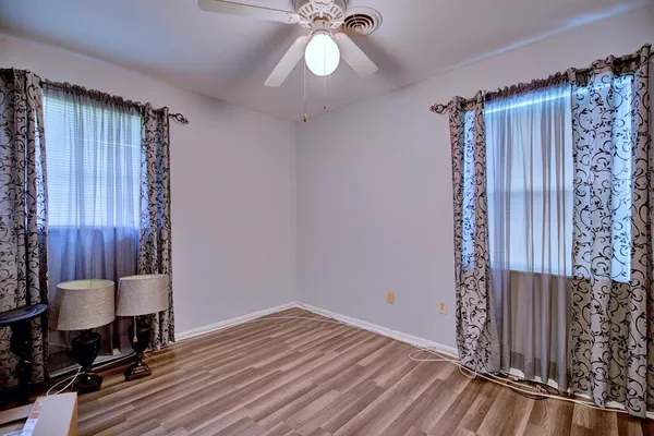 a view of workspace with wooden floor