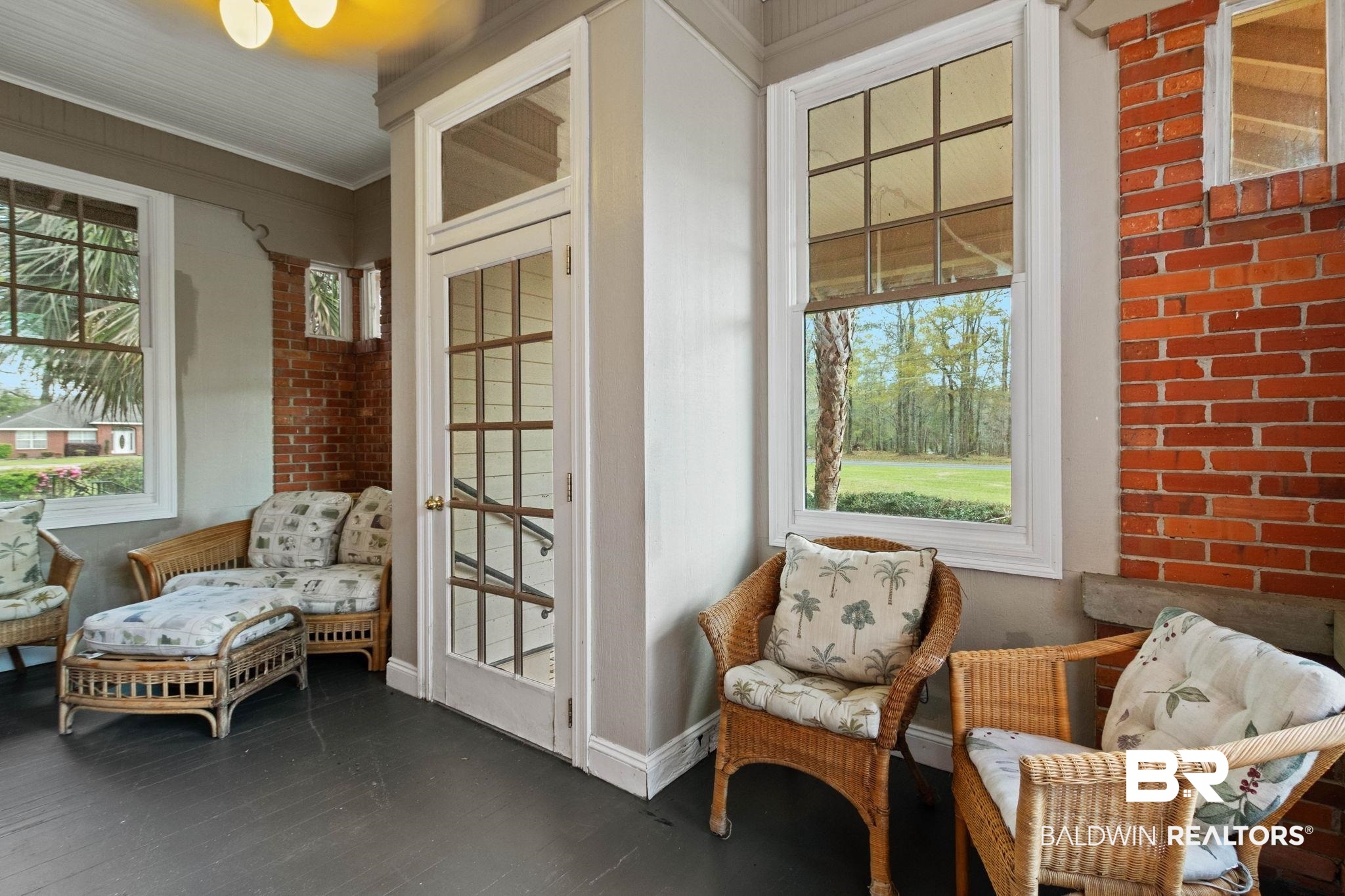 1701 Sowell Road Brewton, AL 36426 - Photo 68 of 83 Living area featuring wood finished floors, brick wall, and crown molding