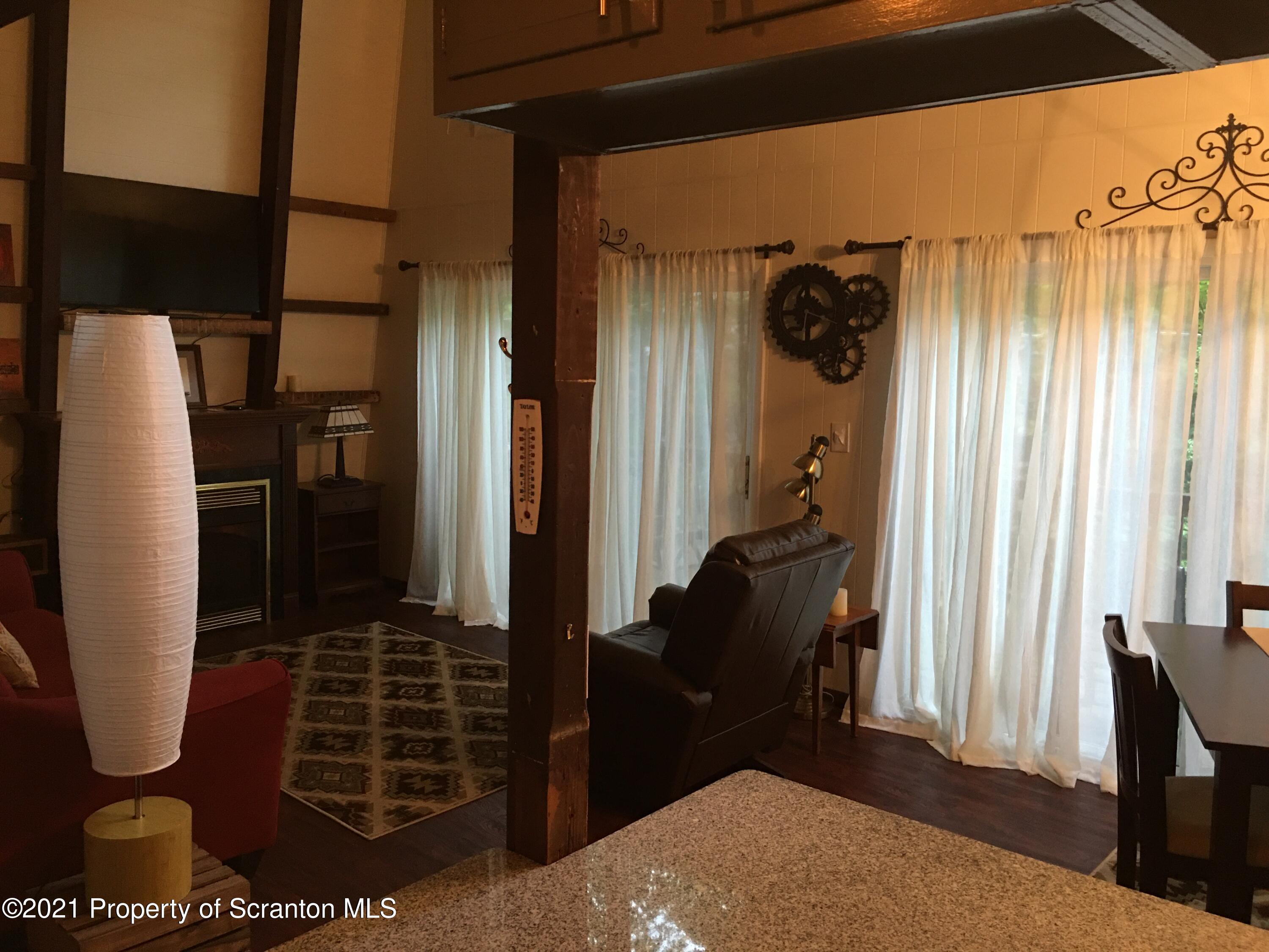 1635 Ridgeview Drive Lake Ariel, PA 18436 - Photo 8 of 24 a bedroom with a bed a dresser and potted plants