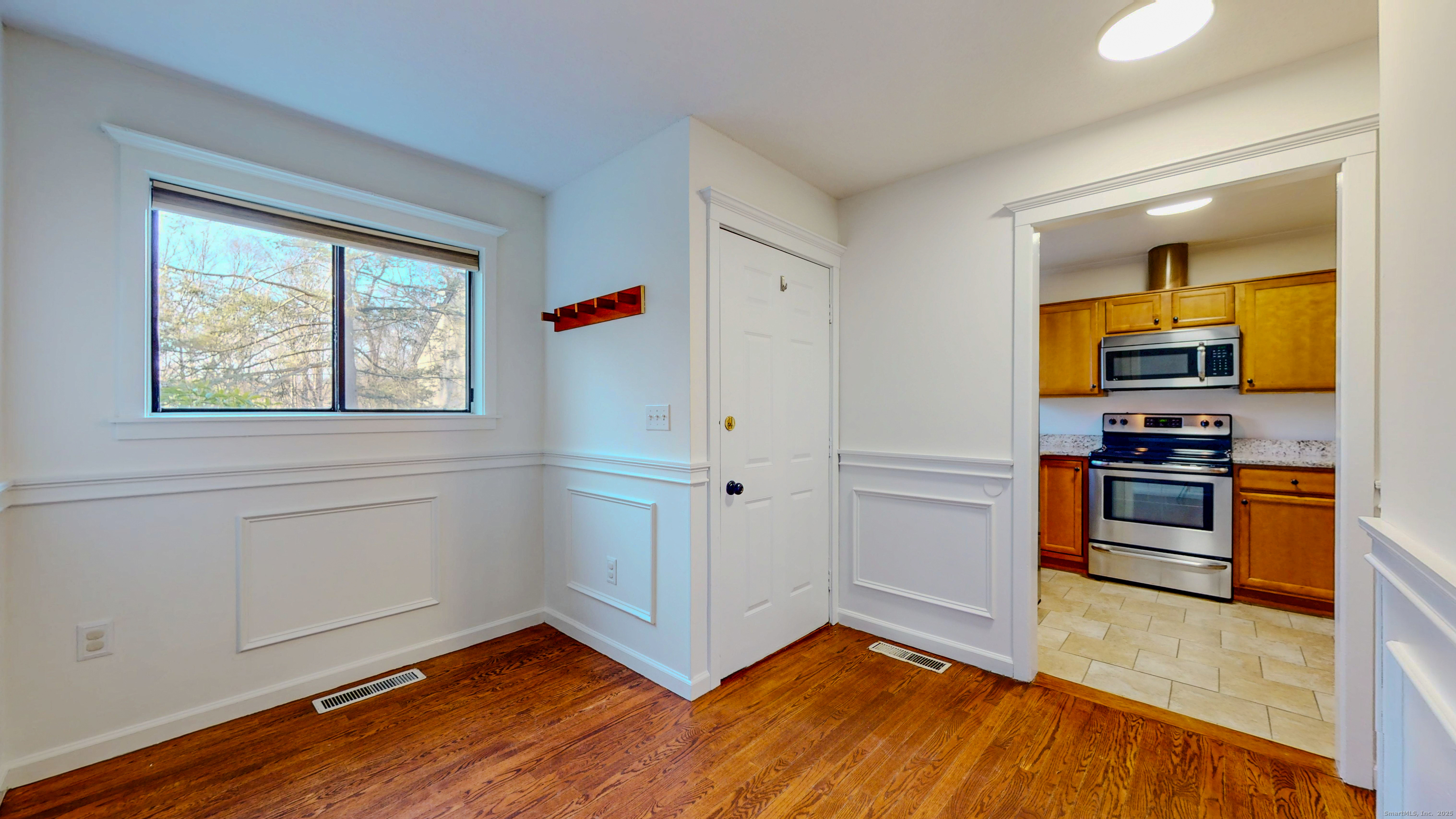 4 Fox Run, Unit 4 Woodbury, CT 06798 - Photo 3 of 25 a view of kitchen with wooden floor electronic appliances and window