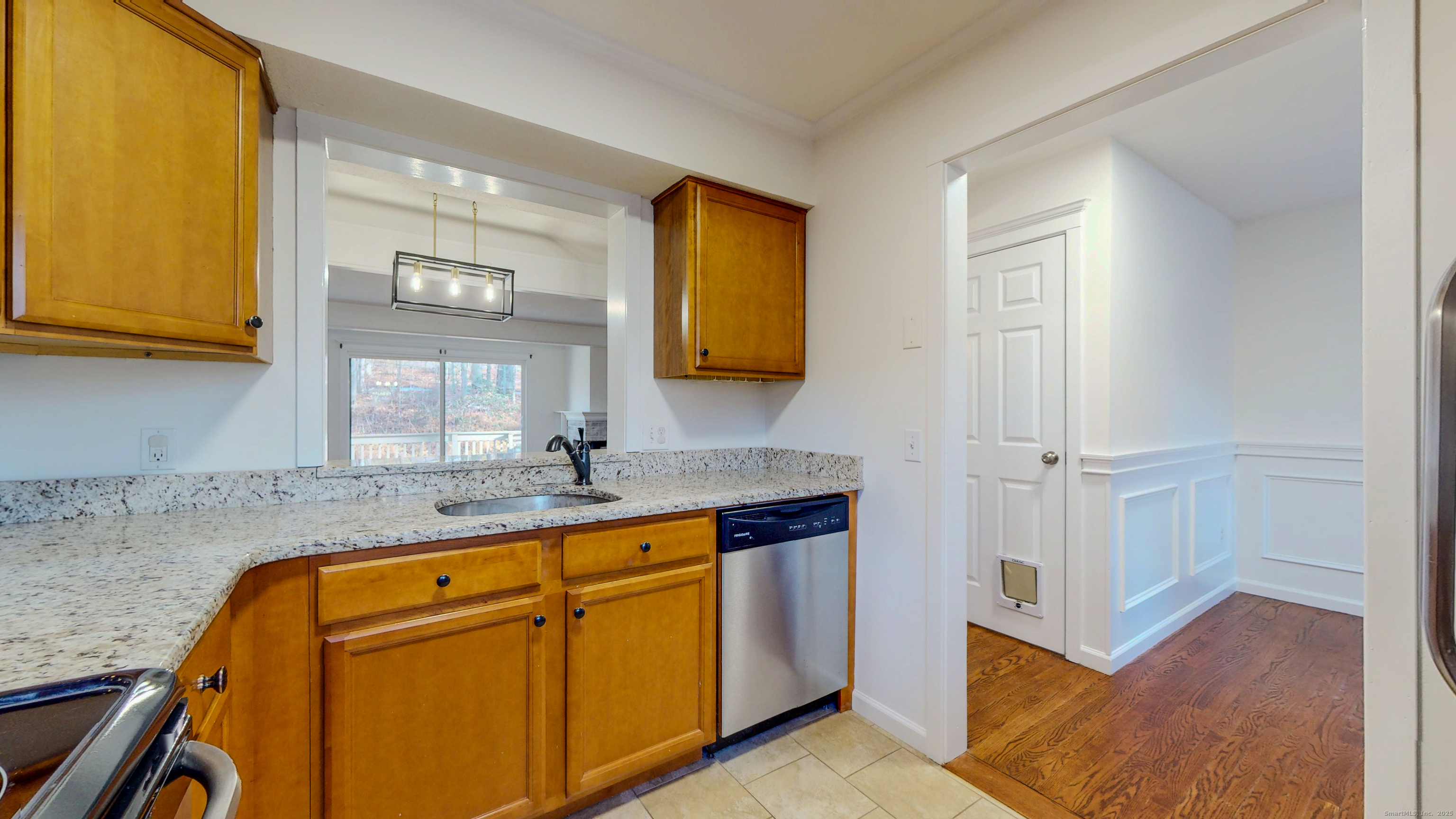 4 Fox Run, Unit 4 Woodbury, CT 06798 - Photo 5 of 25 a bathroom with a granite countertop sink a mirror and a bathtub