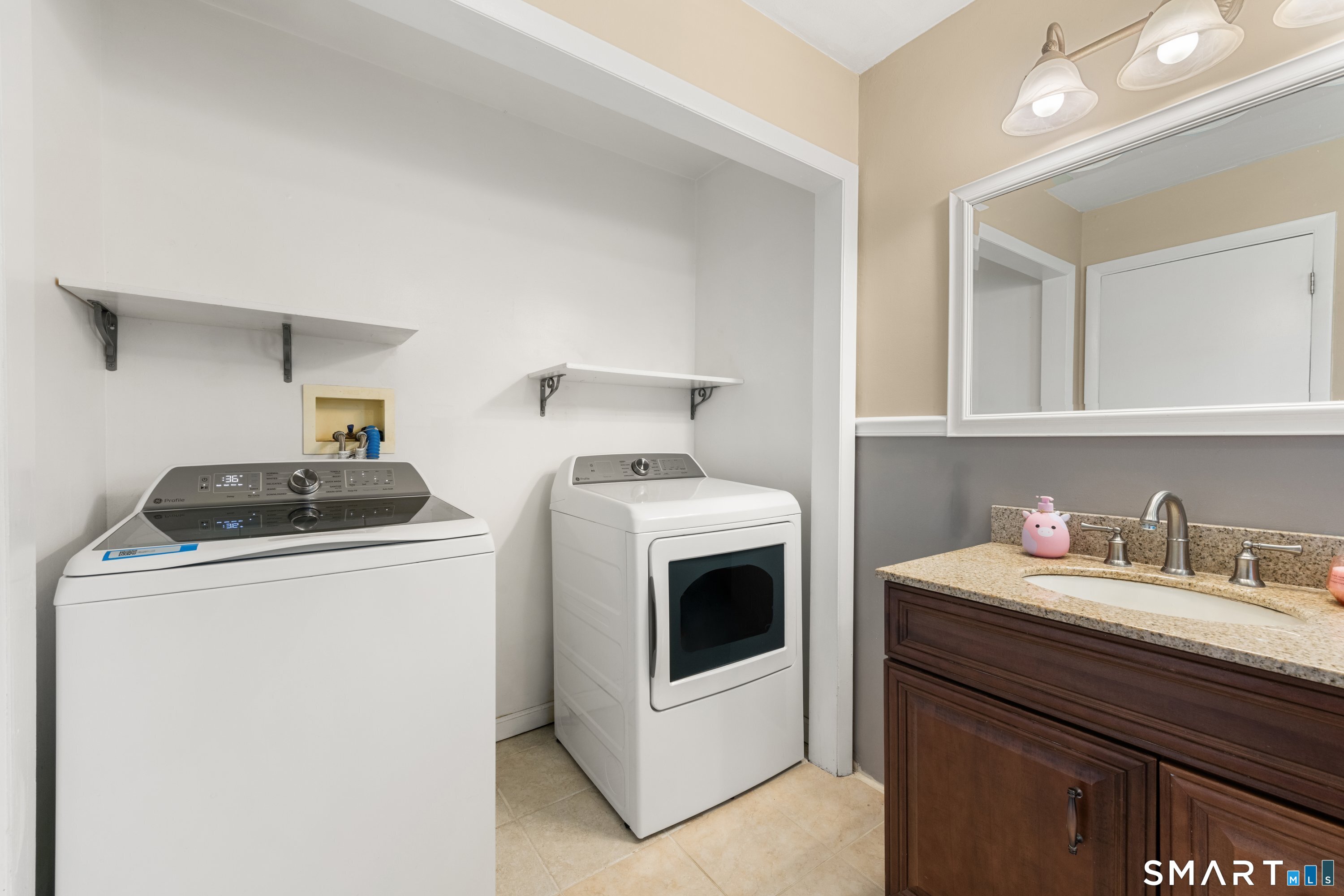 3 Pebble Road Newtown, CT 06470 - Photo 28 of 38 Easy to keep up with laundry here- the washer and dryer are in the main level hall bath! No more lugging laundry up and down the stairs!!