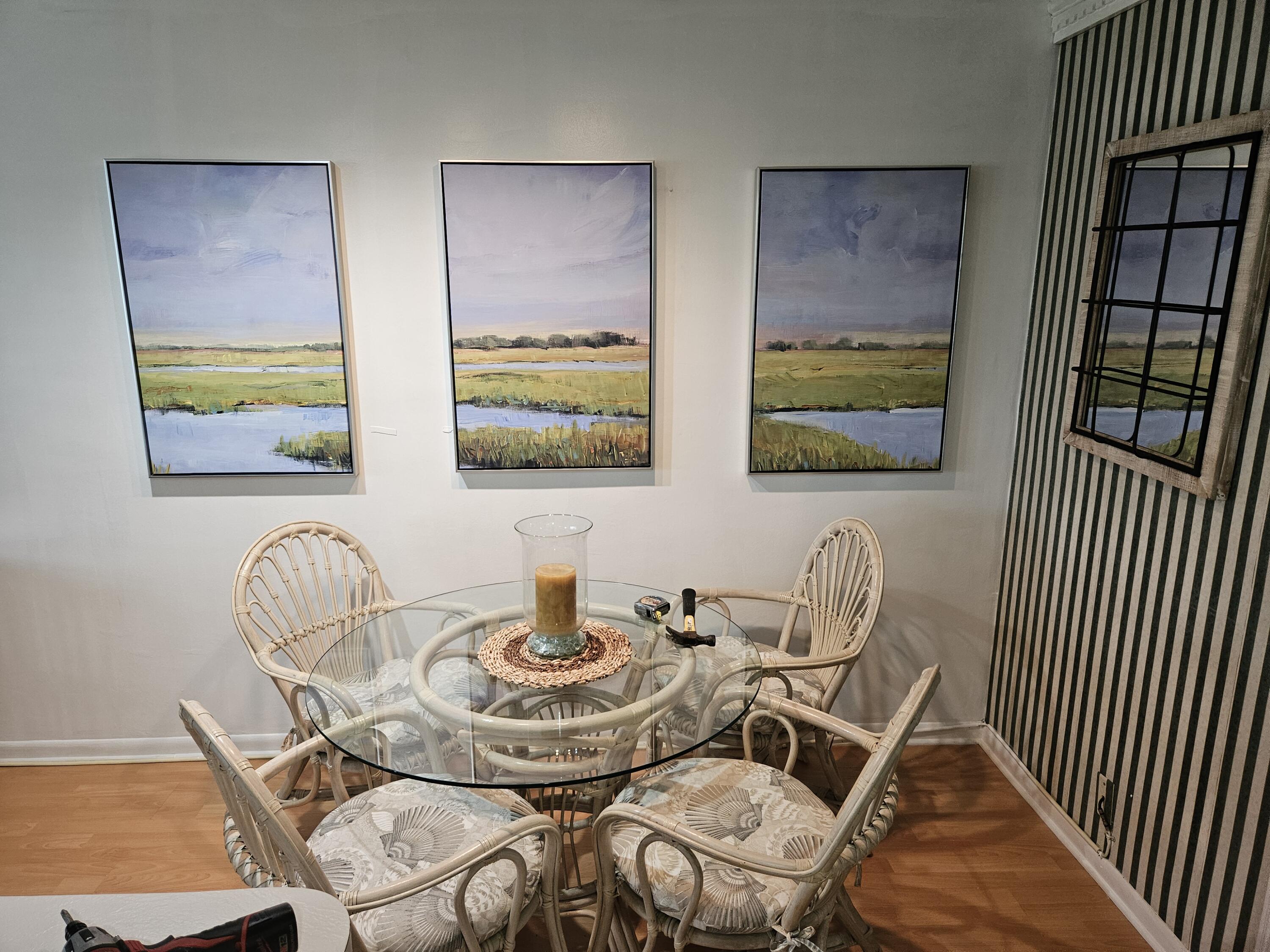 680 Horizon West, Unit 211 Boynton Beach, FL 33435 - Photo 6 of 6 a dining room with furniture and wooden floor