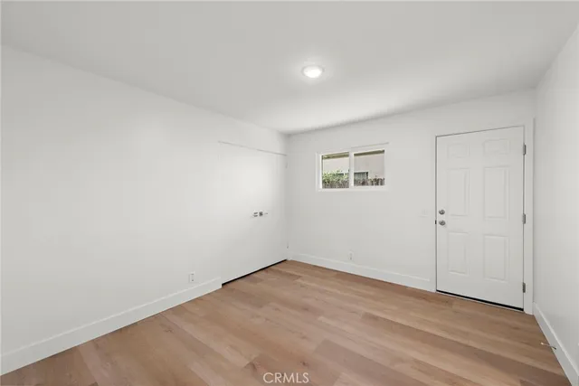 an empty room with a bench