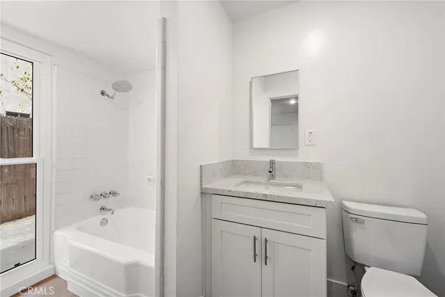a bathroom with a sink toilet and bathtub