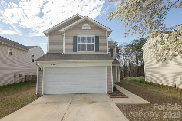 a front view of a house with a garage