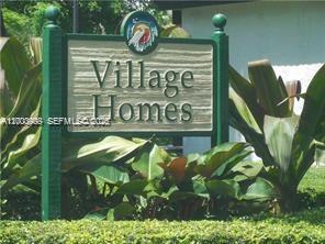 4824 Southwest 152nd Court, Unit 32G Miami, FL 33185 - Photo 1 of 24 a sign that is on a pole