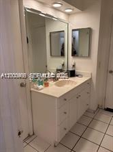 4824 Southwest 152nd Court, Unit 32G Miami, FL 33185 - Photo 14 of 24 a bathroom with a sink vanity and mirror