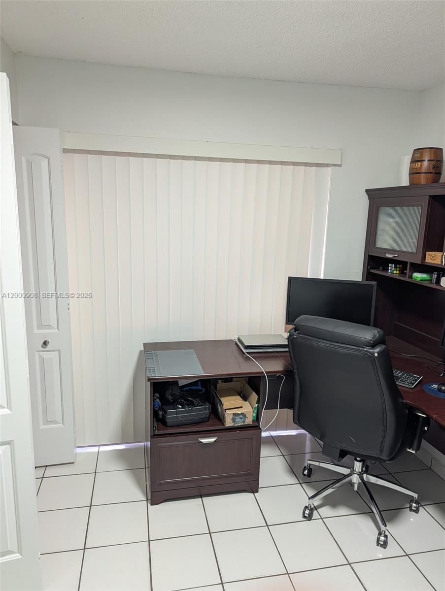 4824 Southwest 152nd Court, Unit 32G Miami, FL 33185 - Photo 17 of 24 a room with furniture and a window
