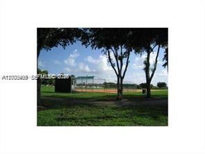 4824 Southwest 152nd Court, Unit 32G Miami, FL 33185 - Photo 23 of 24 a view of outdoor space with garden