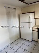 4824 Southwest 152nd Court, Unit 32G Miami, FL 33185 - Photo 7 of 24 a view of a refrigerator in a kitchen