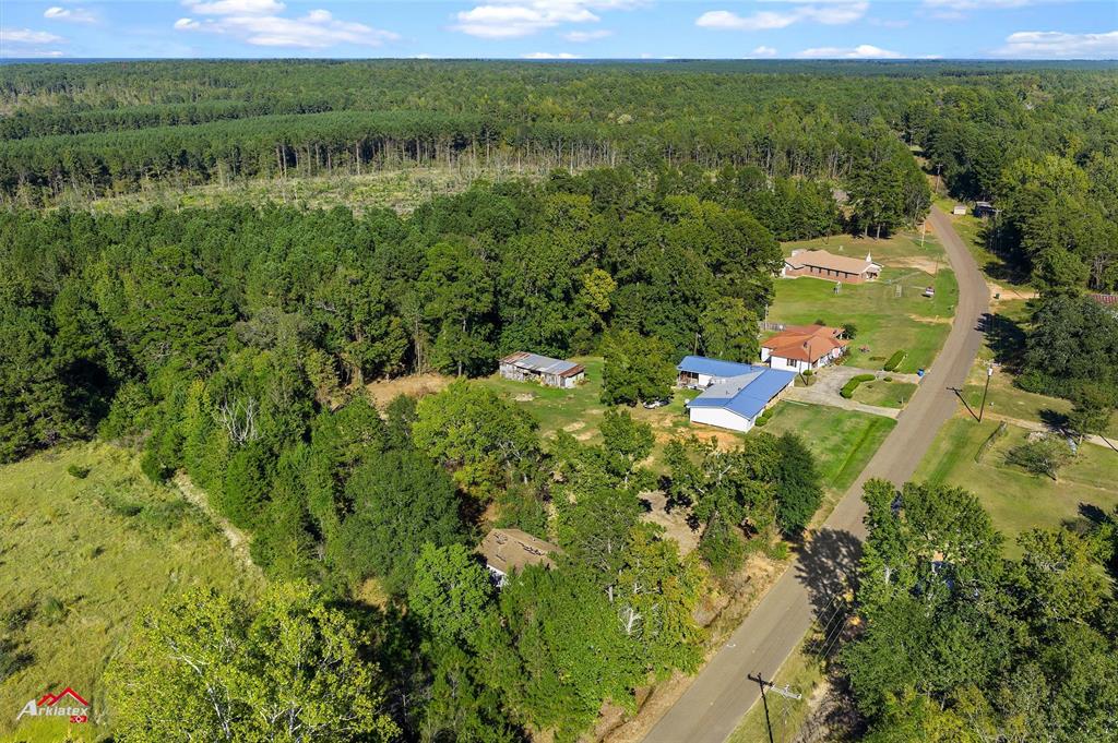 0 Bolinger Cutoff Road Plain Dealing, LA 71064 - Photo 9 of 13 a view of a garden with a building in the background