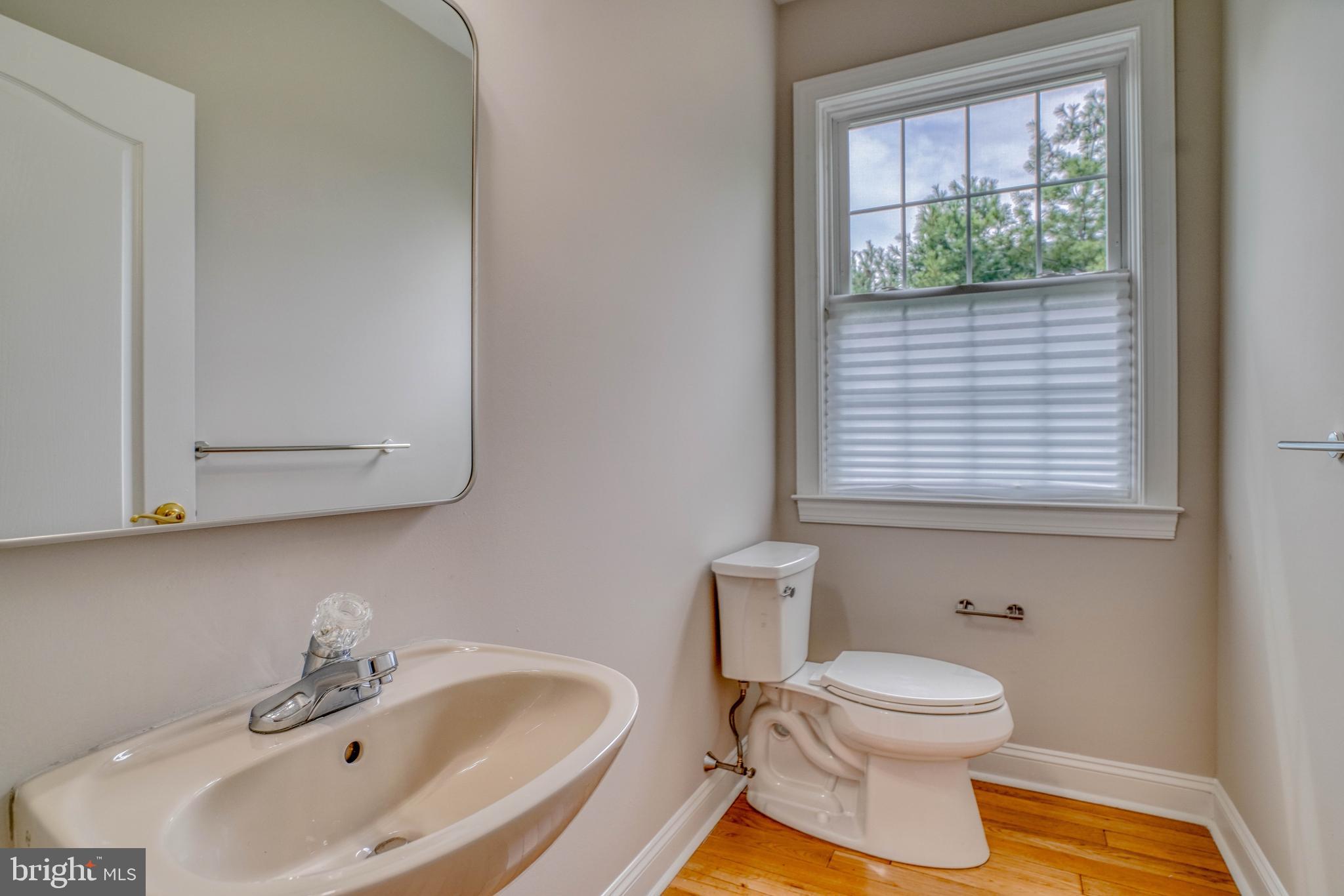 9902 Player Drive Philadelphia, PA 19115 - Photo 33 of 67 a bathroom with a sink a toilet and a window