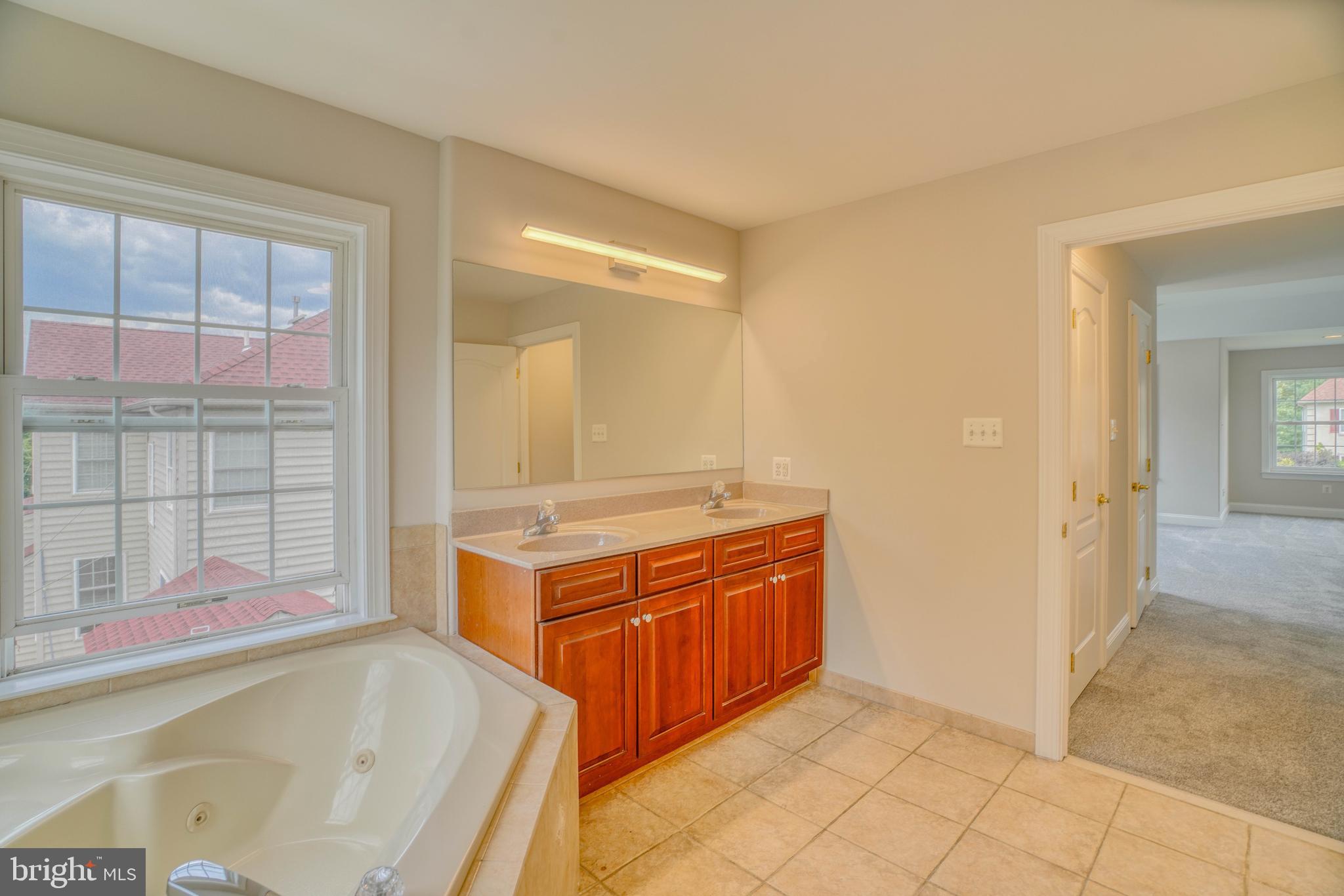 9902 Player Drive Philadelphia, PA 19115 - Photo 42 of 67 a bathroom with a tub sink and mirror