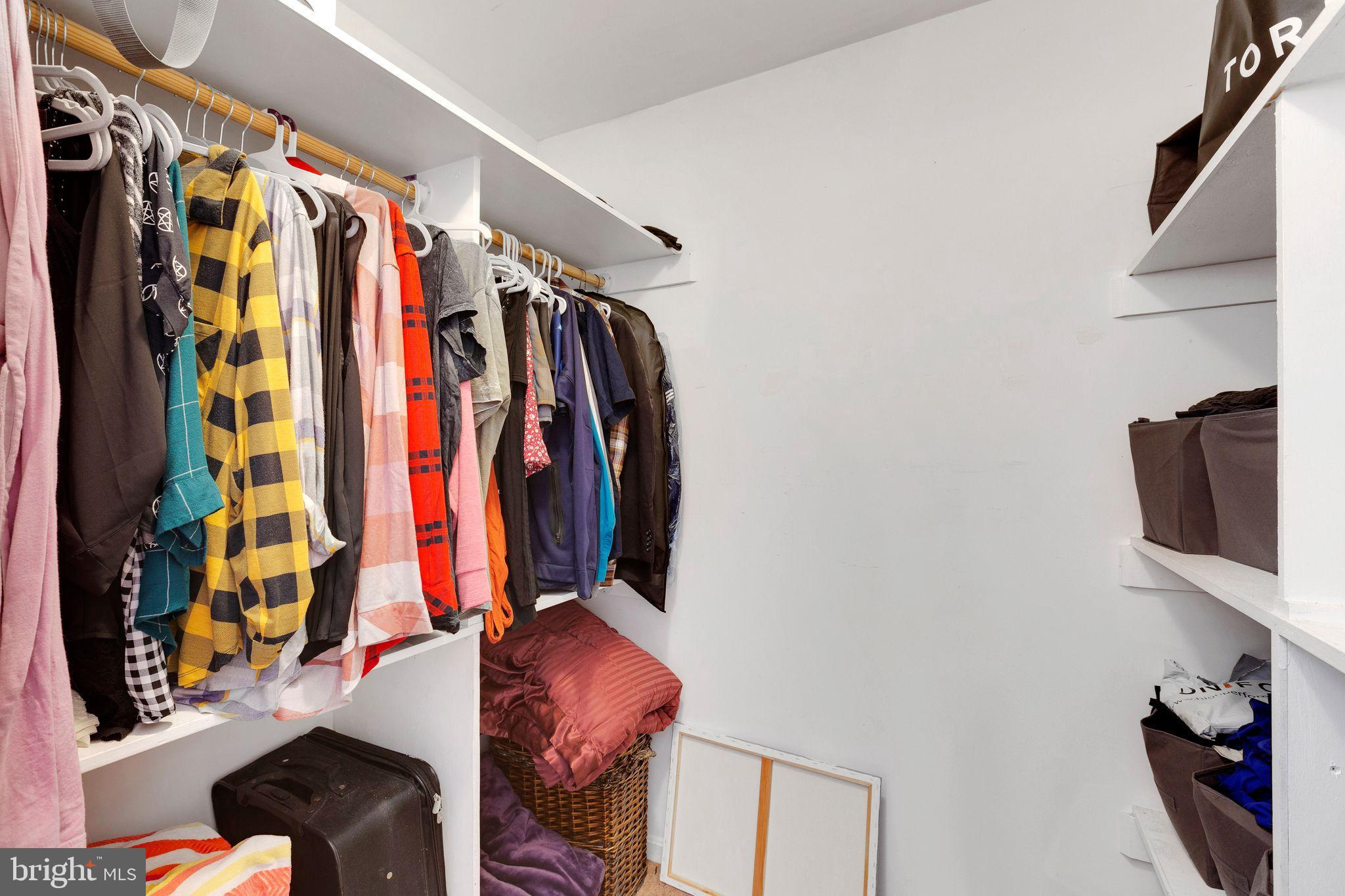 128 7th Street Colonial Beach, VA 22443 - Photo 17 of 32 a view of walk in closet with clothes and shoes