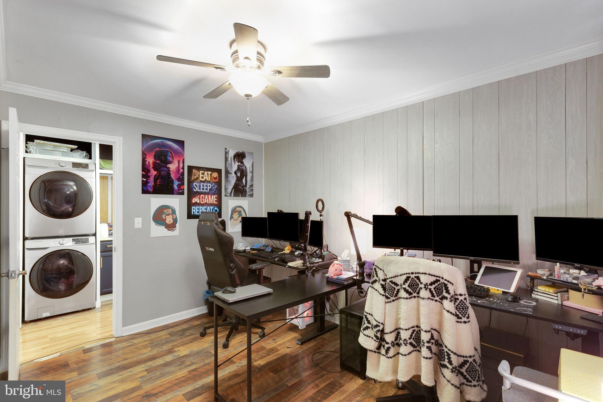 128 7th Street Colonial Beach, VA 22443 - Photo 20 of 32 a view of a workspace with furniture and a fireplace