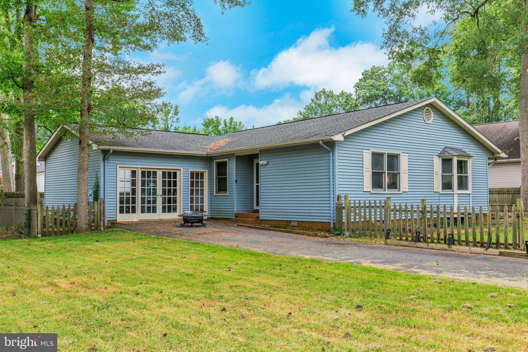 128 7th Street Colonial Beach, VA 22443 - Photo 2 of 32 a view of a house with backyard and garden