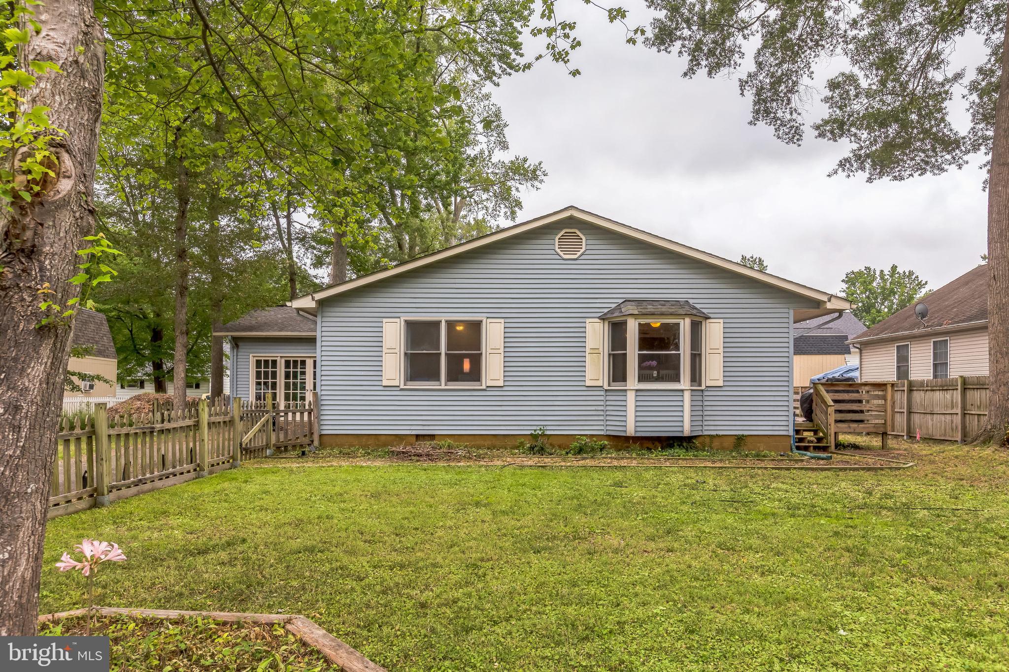 128 7th Street Colonial Beach, VA 22443 - Photo 26 of 32 a house view with a garden space