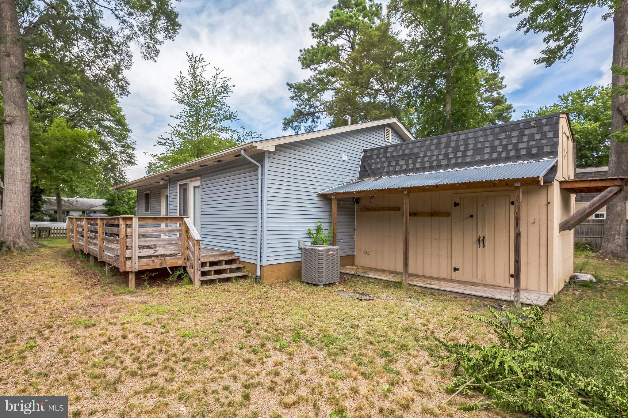 128 7th Street Colonial Beach, VA 22443 - Photo 28 of 32 a view of a house with backyard and sitting area