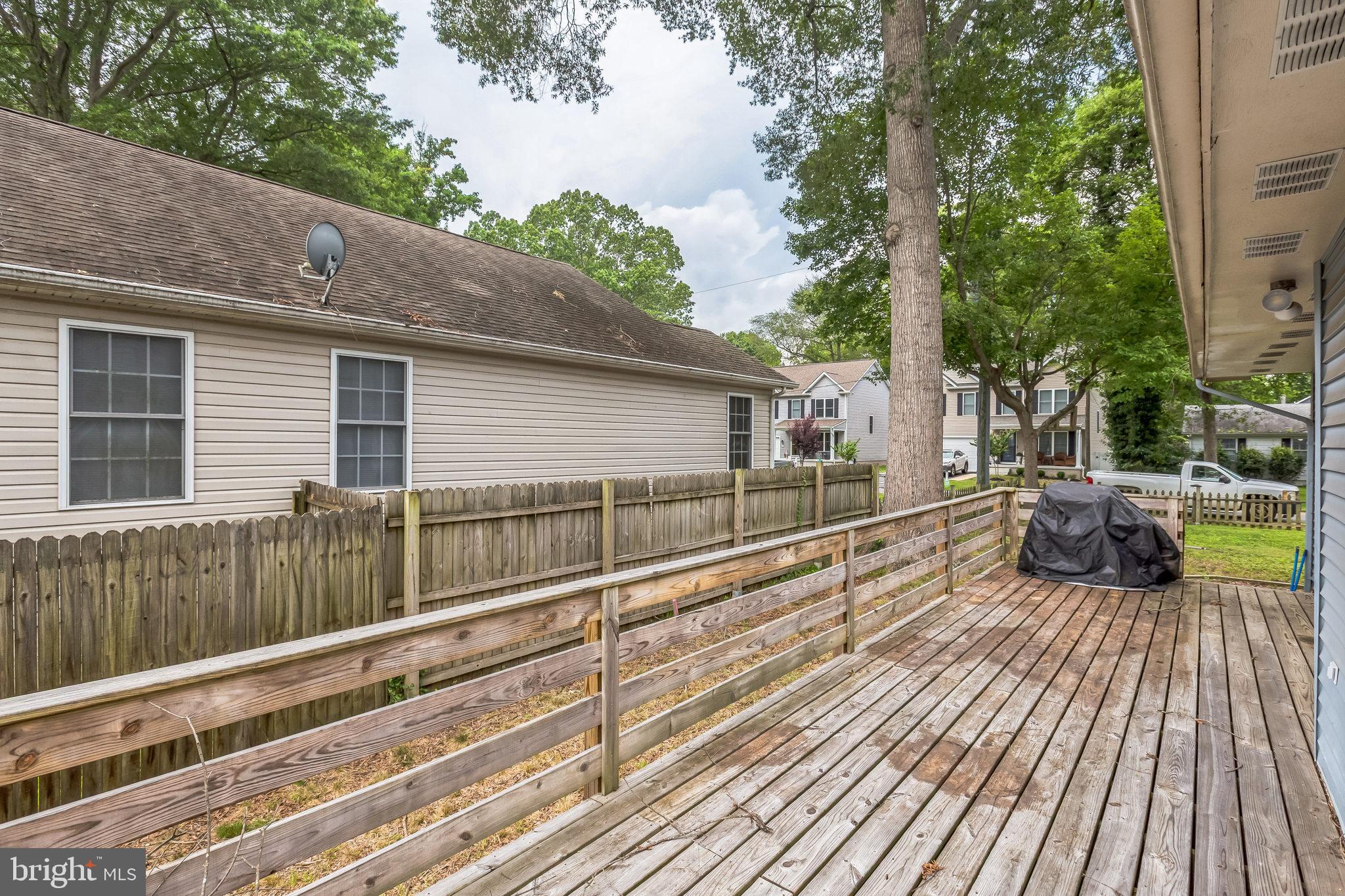 128 7th Street Colonial Beach, VA 22443 - Photo 30 of 32 a view of a balcony with wooden floor and outdoor space